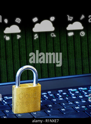 Golden padlock on computer laptop keyboard with Cloud Computing icons and binary data. Concept of Internet security, data privacy, cybercrime preventi Stock Photo