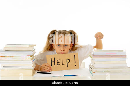 Sad tired and angry blonde school girl holding help sign in stress doing homework and studying with books in children education and low academic perfo Stock Photo