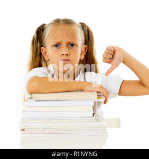 Overwhelmed little girl with a negative attitude towards studies and school after studying too much and having too many homework in children education Stock Photo