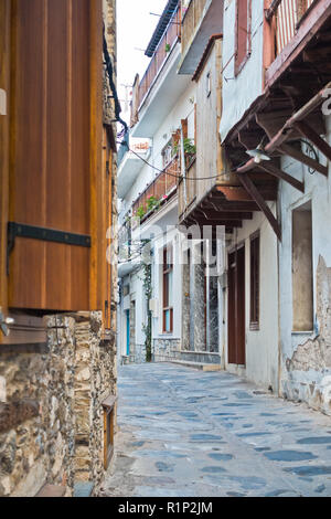 Narrow alleys with traditional greek houses at Skopelos old town, sunset at Skopelos island, Greece Stock Photo