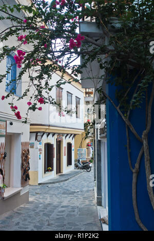 Narrow alleys with traditional greek houses at Skopelos old town, sunset at Skopelos island, Greece Stock Photo