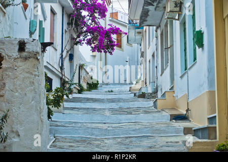 Narrow alleys with traditional greek houses at Skopelos old town, sunset at Skopelos island, Greece Stock Photo