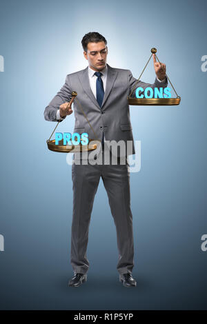 Businessman choosing pros and cons Stock Photo