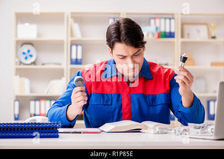 Worker in uniform working on project Stock Photo