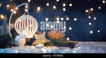 Christmas Lantern On Snow With Fir Branch In Evening Scene Stock Photo