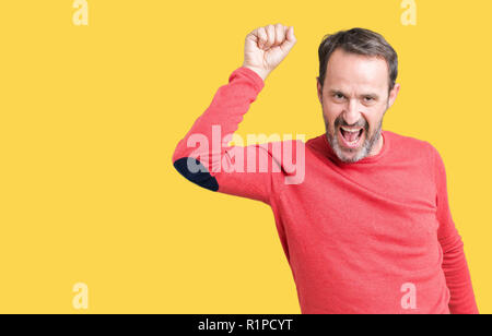 Handsome middle age hoary senior man wearing winter sweater over isolated background Dancing happy and cheerful, smiling moving casual and confident l Stock Photo