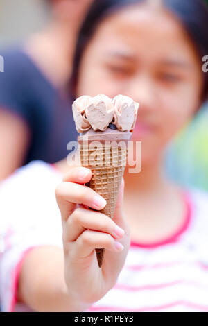 ice cream in young girl hand Stock Photo