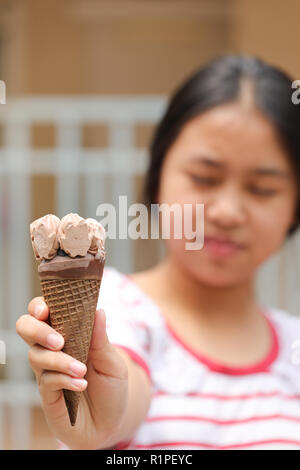 ice cream in young girl hand Stock Photo