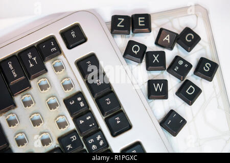 Broken Computer Keyboard on White Background Stock Photo