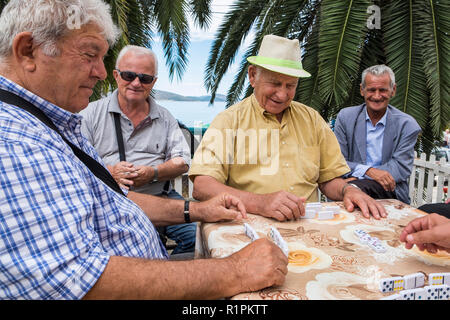 Albania, Sarande,  elderly playing dominoes Stock Photo