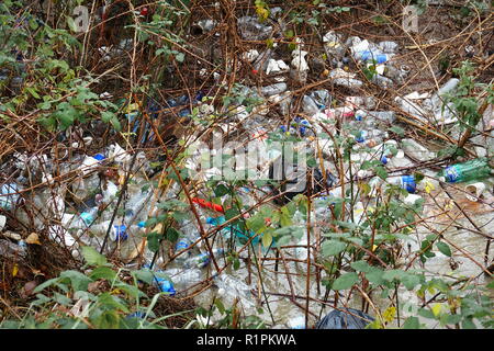 Milan, Italy - november 2017: environmental pollution of non-biodegradable waste abandoned in a city park
