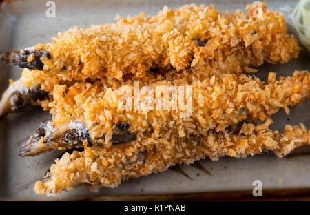 Shishamo fish deep fried serve with Japanese sauce style. Stock Photo