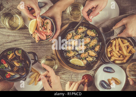 Family having summer lunch with seafood, top view Stock Photo