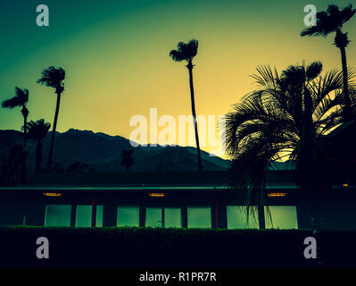 Mountains, Palm Trees and Motel Lights in Palm Springs at Sunset with Copy Space Stock Photo