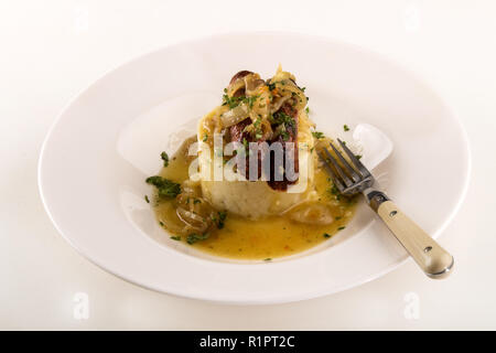 traditional irish bangers with mashed potatoes, sausages with grilled onions and gravy Stock Photo