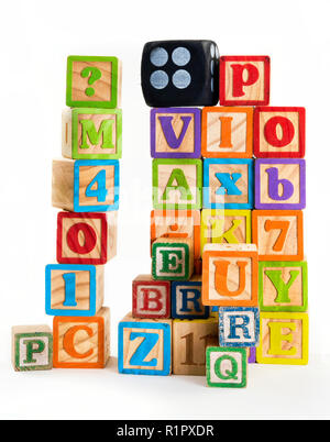 Stacked up high alphabet building blocks. Stock Photo