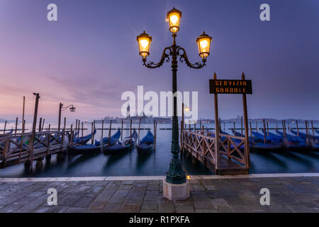 Gondolas moored at San Marco at dawn, Venice, Italy Stock Photo