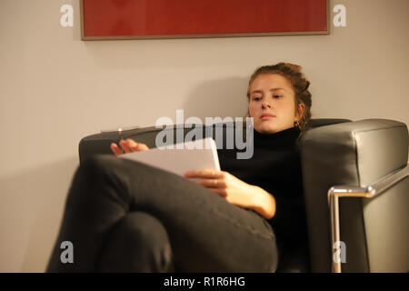 Law student during exam preparation at home. Stock Photo