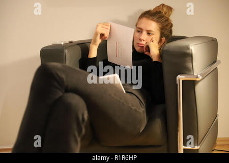 Law student during exam preparation at home. Stock Photo
