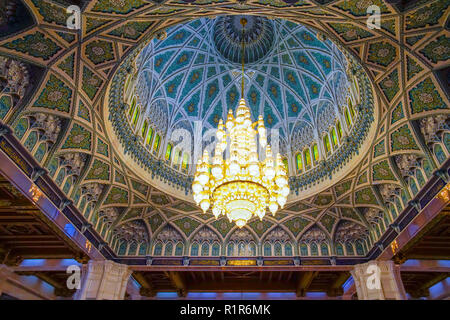 Inside Men's room of prayer in Sultan Qaboos impressive new Grand Mosque. The second largest chandelier in the world. Muscat, Oman. Stock Photo