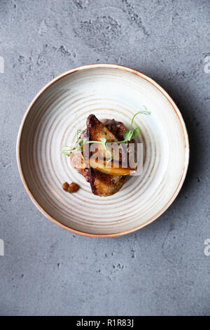 Esthetic French foie gras with apple and pear chutney on the toast in minimalistic style Stock Photo