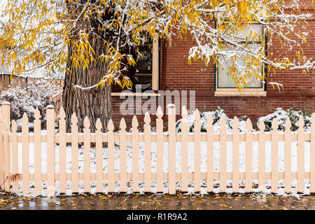 View of ice-covered wooden fence posts on a snowy mountain ridge in ...