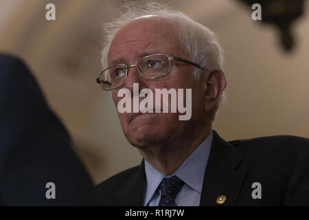 Washington, District of Columbia, USA. 14th Nov, 2018. United States Senator Bernie Sanders (Independent of Vermont) looks on as United States Senate Minority Leader Chuck Schumer (Democrat of New York) speaks to reporters during a press conference following Senate Democratic Leadership Elections at the United States Capitol on Capitol Hill in Washington, DC on November 14, 2018. Credit: Alex Edelman/CNP Credit: Alex Edelman/CNP/ZUMA Wire/Alamy Live News Stock Photo
