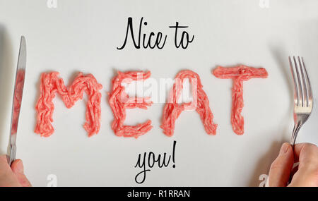 Nice To Meat You Written On White Background With Real Meat Stock Photo