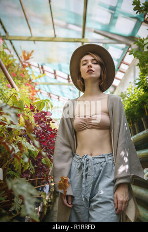 Fashionable young woman wearing in hat and poncho. Stock Photo