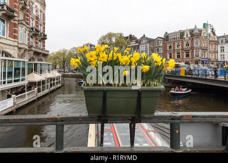 Amsterdam, Netherlands - April 20, 2017: Canal  scene with  traditional Dutch houses in Amsterdam. Netherlands Stock Photo