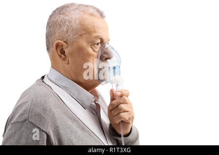 Mature man using an inhaler isolated on white background Stock Photo