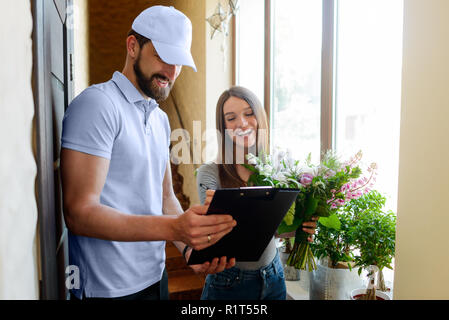 Happy woman received bouquet Stock Photo