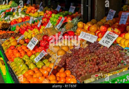 Assortment of fresh fruits like apples, pears, grapes and oranges for sale at a stall at Pike Place Market in Seattle, Washington Stock Photo