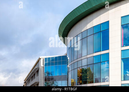 sunny day view of windows of modern business corporate office building in northampton england uk. Stock Photo