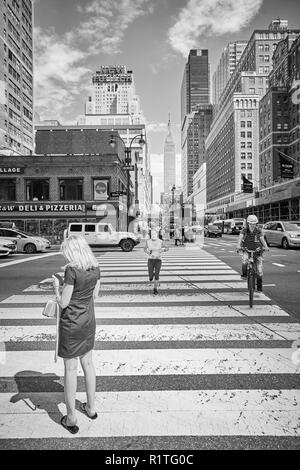 New York, USA - June 28, 2018: City life in the 'Big Apple', this nickname for New York City first introduced in the 1920s by John J. Fitz Gerald. Stock Photo