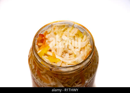 Preserved cabbage and red paprika salad in glass jar on a white background 2018 Stock Photo