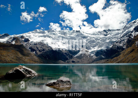 Beautiful cochagrande lagoon at the foot of the snowcapped cochas in the Huaytapallana mountain range. Stock Photo