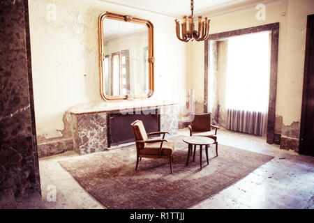 Bad Gastein, Austria - March 15, 2015: Furniture in room at the abandoned Hotel Straubinger. Stock Photo