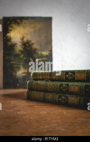 Three vintage encyclopedias stacked on top of each other Stock Photo