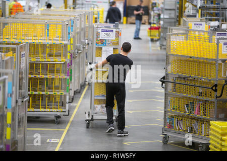 Staff at the Amazon fulfilment centre in Hemel Hempstead, Hertfordshire, preparing for Black Friday this week.  Staff at Amazon are preparing for their busiest Black Friday on record - with 10 days of deals starting on Friday (16), which will see customers save thousands on must-have gifts.  Workers at the Hemel Hempstead fulfilment centre in Hertfordshire are getting ready for a frantic festive season of picking and packing, with millions of Brits set to snap up the limited time deals in the run up to Christmas. Stock Photo