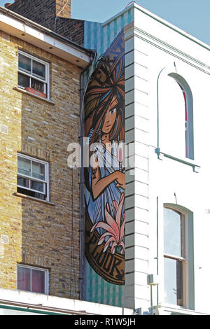 London, United Kingdom - November 19, 2011: First Floor Restaurant Wall Art by Inkie at Portobello in London, UK. Stock Photo