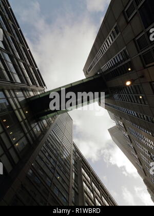 Look up next to skyscrapers with sky reflections on the tall buildings in the city of London. Modern city look. Stock Photo