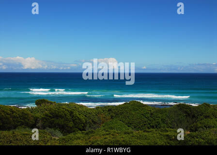 A beautiful coastal view of the Cape Peninsula of South Africa creates a wonderful background.  Note the ample space in the blue sky for your text. Stock Photo