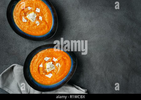 Top view of pumpkin soup in two plates Stock Photo