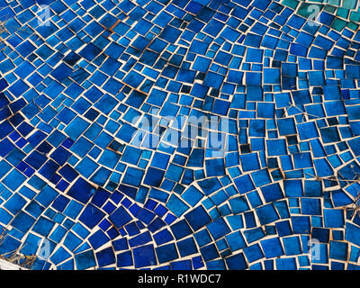 patterned design of tiled blue mosaic floor of drained outside pool at Renaissance patrician Villadi Pratolino in the hills above Florence Italy Stock Photo