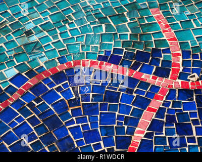 patterned design of tiled blue & red mosaic floor of outside pool at Renaissance patrician Villa di Pratolino in the hills above Florence Italy Stock Photo