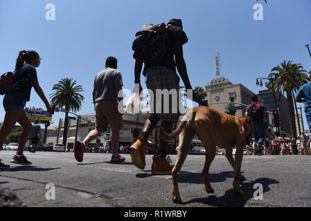 HOLLYWOOD - August 7, 2018: People crossing the road from low angle point of view on Hollywood blvd in Hollywood, CA. Stock Photo