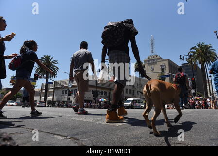 HOLLYWOOD - August 7, 2018: People crossing the road from low angle point of view on Hollywood blvd in Hollywood, CA. Stock Photo