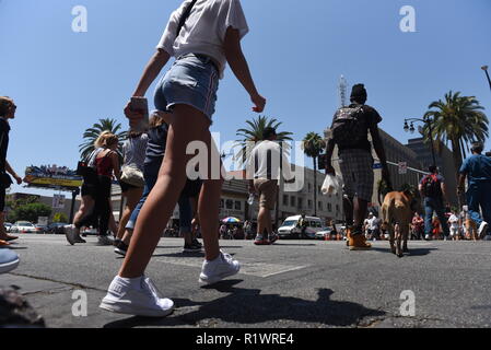 HOLLYWOOD - August 7, 2018: People crossing the road from low angle point of view on Hollywood blvd in Hollywood, CA. Stock Photo