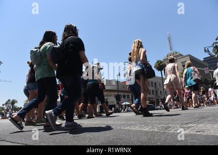 HOLLYWOOD - August 7, 2018: People crossing the road from low angle point of view on Hollywood blvd in Hollywood, CA. Stock Photo